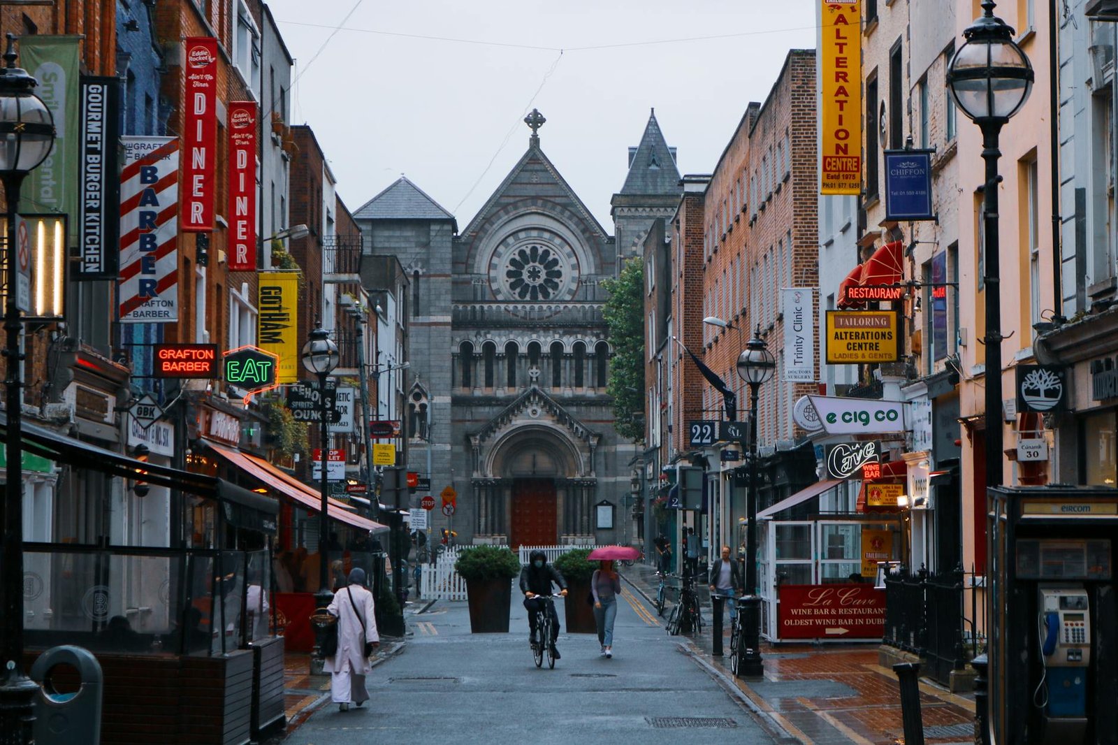 Busy Dublin street scene with people walking - moving to Ireland