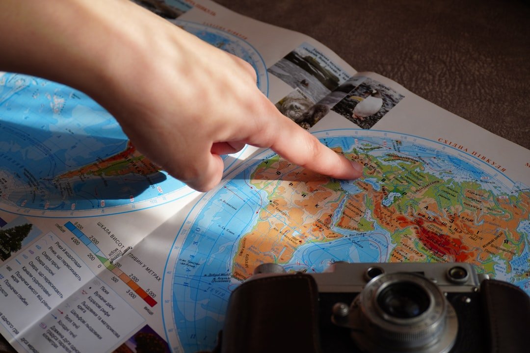 Planning a move abroad - world map and travel documents